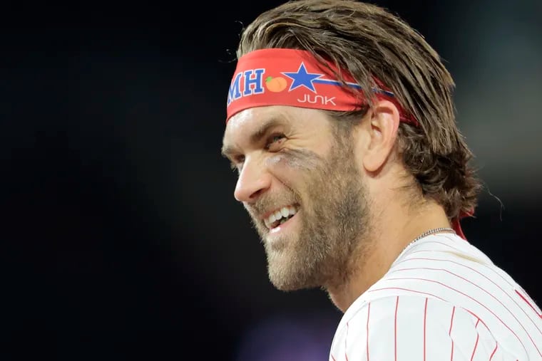 Phils Bryce Harper smiles while standing  at first base during the Chicago Cubs at Philadelphia Phillies MLB game at Citizens Bank Park in Phila., Pa. on Sept. 15, 2021.