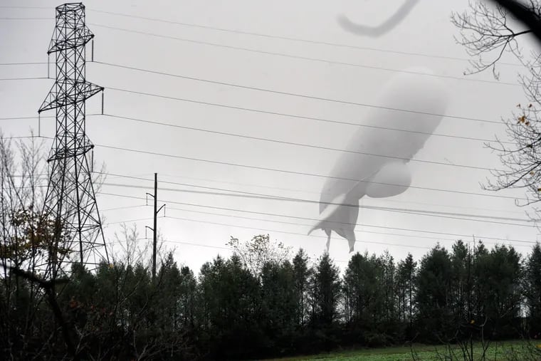 An unmanned Army surveillance blimp floats through the air just south of Millville, Pa.