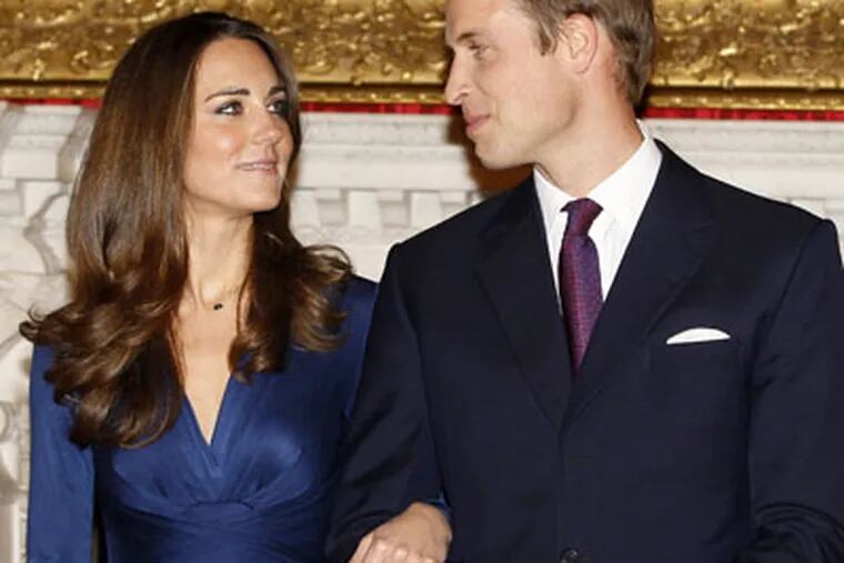 Britain's Prince William and his fiancee Kate Middleton pose for the media at St. James's Palace in London, after they announced their engagement. (AP Photo / Kirsty Wigglesworth)