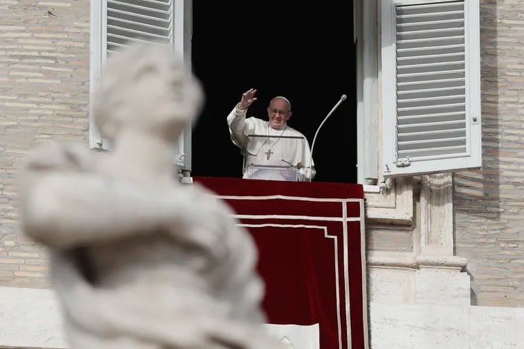 Pope Francis waves to faithful during the Angelus noon prayer in St. Peter's Square, at the Vatican, Sunday, Dec. 16, 2018. (AP Photo/Gregorio Borgia)
