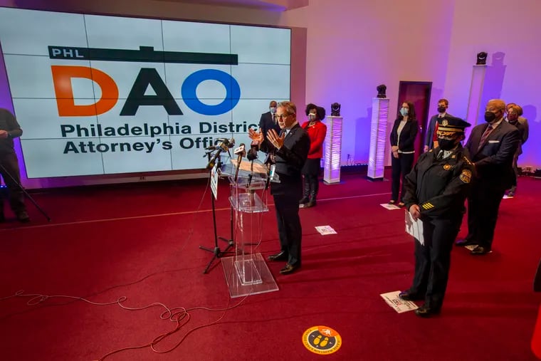 Philadelphia District Attorney Larry Krasner (podium) and members of the Gun Violence Task Force held a news conference at the The Church of Christian Compassion on Monday.