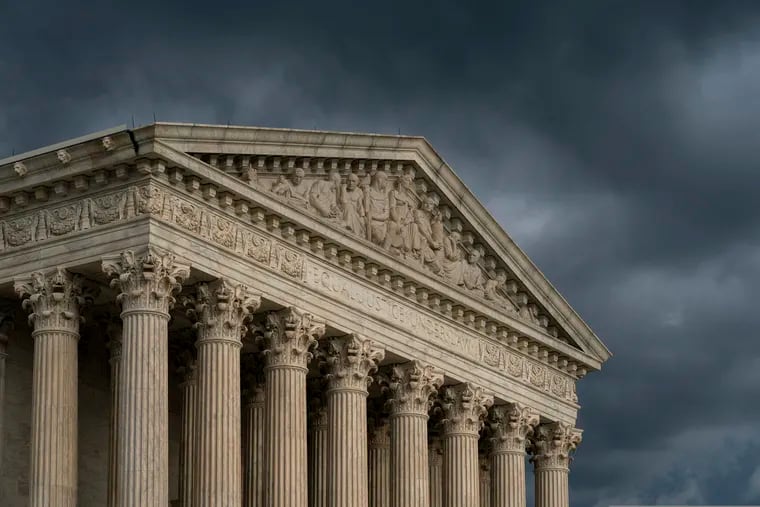 The Supreme Court is seen under stormy skies in Washington.