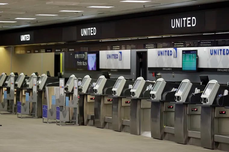 In this April 24 photo, empty United Airlines ticket machines are shown at the Tampa International Airport in Tampa, Fla.