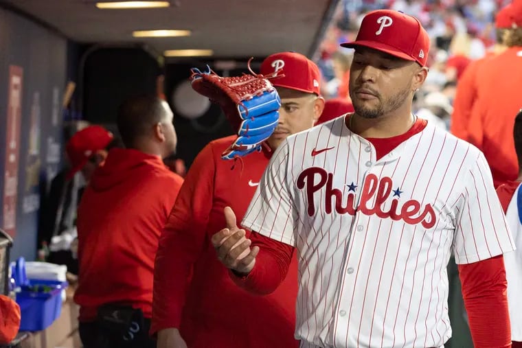 Taijuan Walker of the Phillies flips his glove after being pulled from the game against the Rangers on May 22 at Citizens Bank Park.