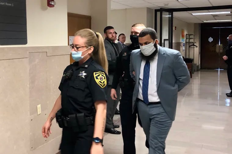 Austin Stevens is escorted out of a courtroom during his trial on murder charges in Montgomery County. Prosecutors say Stevens sexually assaulted and killed his 10-month-old daughter, Zara.