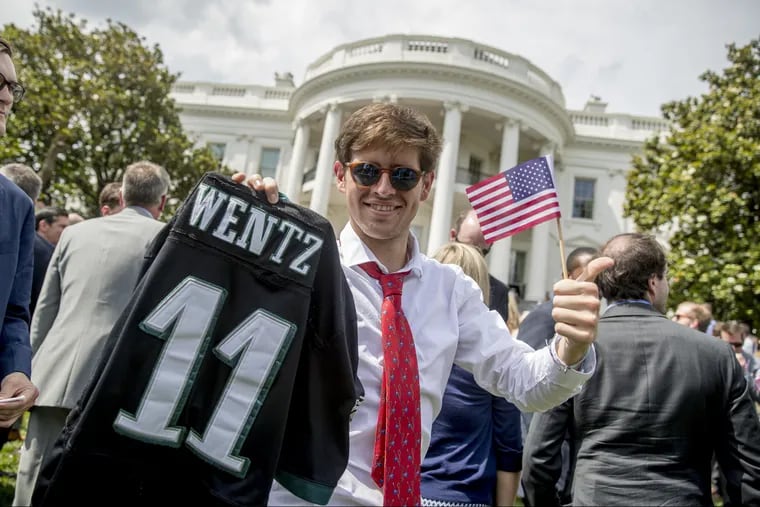 An Eagles fan holds up a Carson Wentz jersey at the June 2018 "celebration of America" at the White House. THe event was held in lieu of an event for the Super Bowl champion Eagles.
