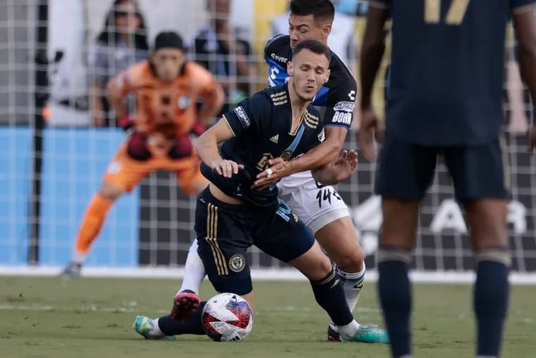 Union’s # 10 Dániel Gazdag is pushed down by Querétaro ’s # 14 Federico Lértora in the first half of the Philadelphia Union vs. Querétaro Fútbol Club Leagues Cup final group stage soccer match at Subaru Park in Chester, Pa. on Wednesday, July 26, 2023.