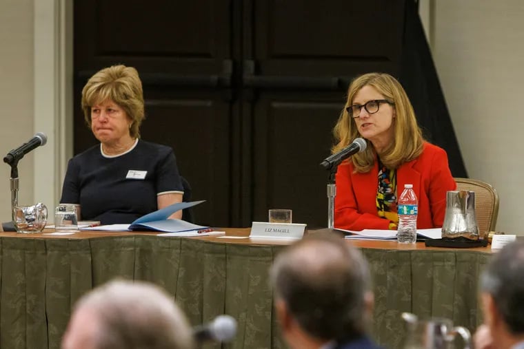 Liz Magill (right), who resigned Saturday as Penn president, and Julie Platt, the interim board of trustees chair, at a Penn board meeting in November.