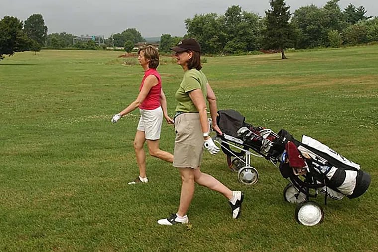 Before the earth movers came: Sylvie Russo of Penn Valley (left) and Nancy Tabas of Haverford playing a round at Valley Forge in 2004. (Inquirer File Photo)