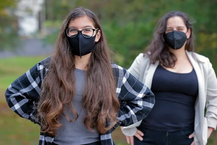 Council Rock South High School ninth grader Lily Beard (left) and her mother, Rachel Beard. Lily said it seems as if half the kids at school aren’t wearing masks.