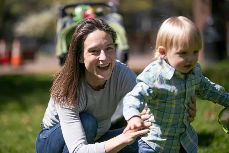 Samantha Brown plays with her son, Ethan Brown, outside of Carpenters' Hall at Independence National Historical Park in Philadelphia on Tuesday, April 28, 2020. Brown is working full time at home while also being a full time mother during the coronavirus pandemic. Brown said they often go to this spot because it is one of the least-crowded parks in Philly.