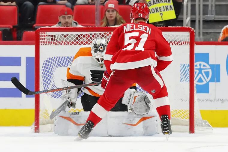 Detroit Red Wings center Frans Nielsen scores the only goal of the shootout on Flyers goaltender Alex Lyon.