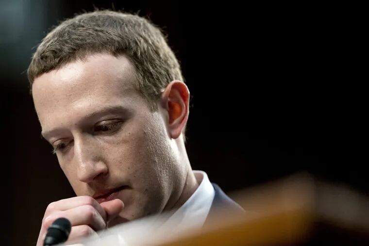 Facebook CEO Mark Zuckerberg pauses while testifying before a joint hearing of the Commerce and Judiciary Committees on Capitol Hill in Washington, Tuesday, April 10, 2018, about the use of Facebook data to target American voters in the 2016 election.