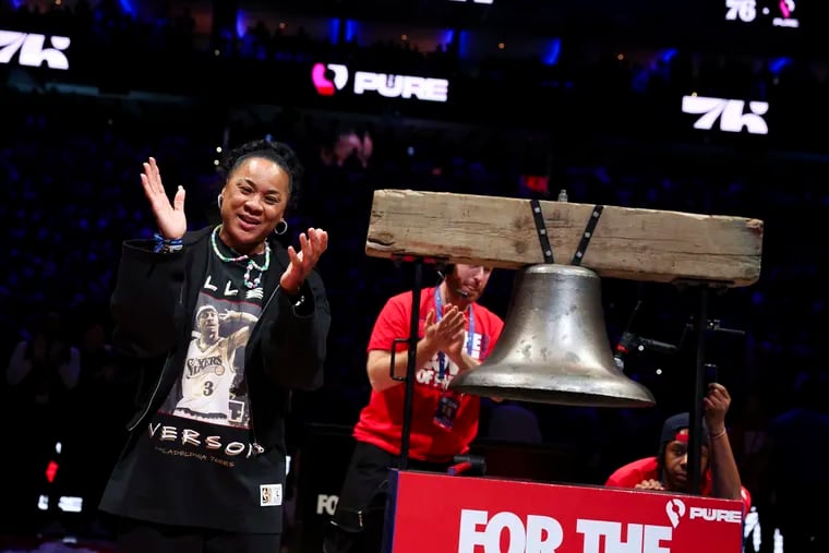 Dawn Staley rings the bell during game 4 at the Wells Fargo Center in Philadelphia, Pa. on Sunday, April 28, 2024. The New York Knicks defeated the Philadelphia 76ers 97 to 92.