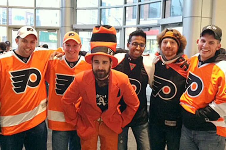 Six local Flyers fans are following the team through Western Canada. (Sam Carchidi/Staff)