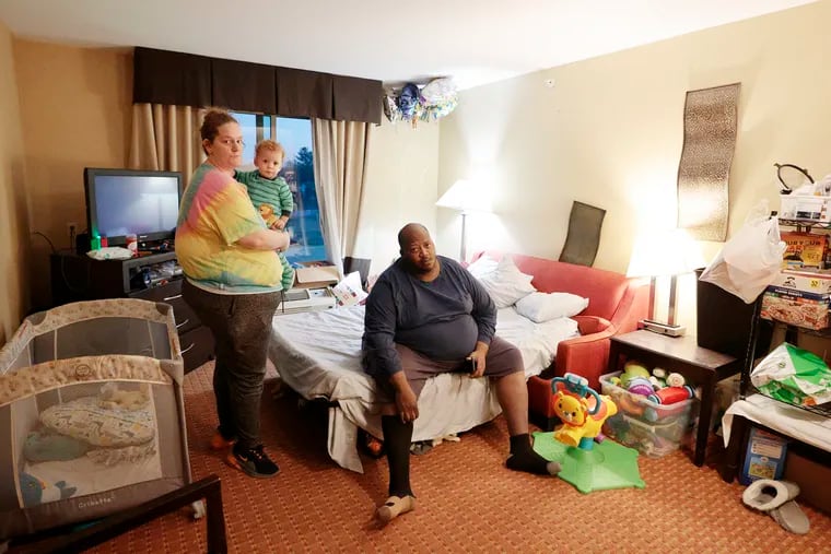 Courtney Ryan and Verdon Taylor and their 1-year-old son Kingston Taylor in their Exton hotel room Wednesday. Some victims of Hurricane Ida whose homes were destroyed in the flood and now are still living in hotels six months later. They are struggling to find anywhere to live because rental prices are so high and there's a lack of affordable housing.