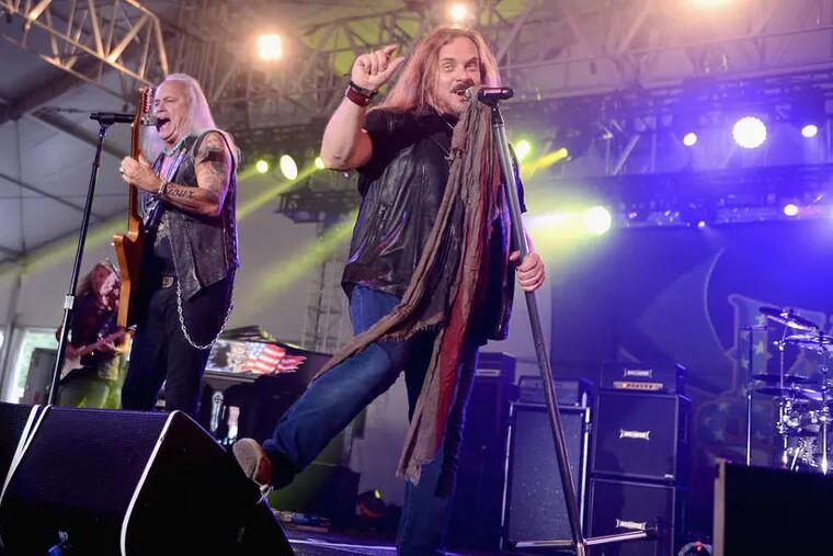 Lynyrd Skynyrd's Rickey Medlocke (left) and Johnny Van Zant. The band no longer performs with a Confederate flag, saying the symbol was &quot;kidnapped&quot; by the KKK.
