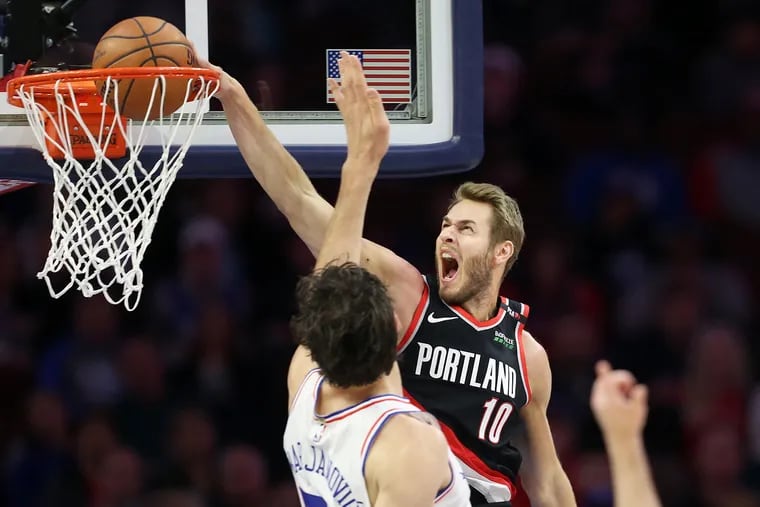 Jake Layman dunks over Boban Marjanovic during the Sixers' loss on Sunday. Players like Marjanovic, or Amir Johnson, or Jonah Bolden, might not be enough to make up for the absence of Joel Embiid.