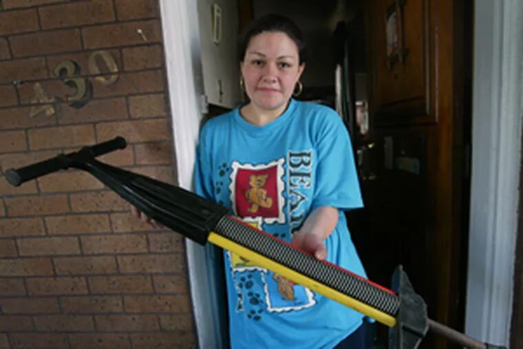 Roxanna Murillo displays pogo stick that Tyler Medina was playing with when he was attacked.