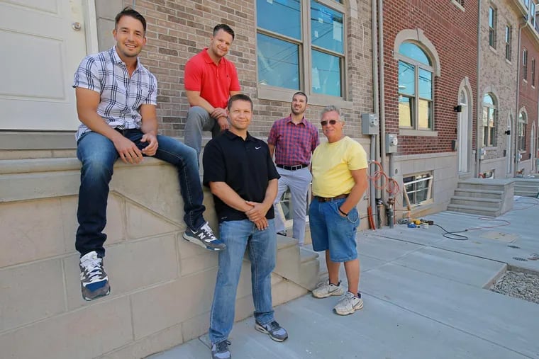 Manayunkers including (from left) C.J. Koch, Steve Olszewski, Andrew Mulson III, Jared Pontz (OK, he's from Mount Airy) and Andy Mulson Sr. are turning the former St. Lucy's Church, school and parking lot into townhouses and apartments.