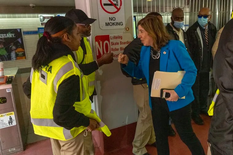 SEPTA CEO Leslie S. Richard exchanges fist bumps with staff members of Scotlandyard, one of the three security companies the transit authority has hired.