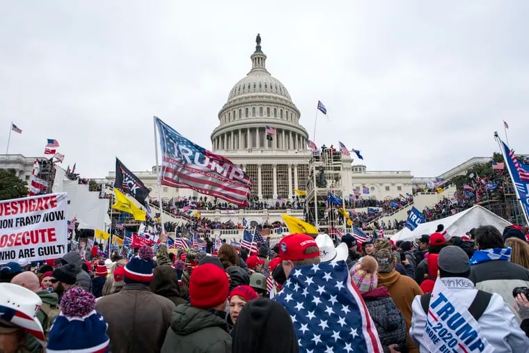 Rioters loyal to Donald Trump surround the U.S. Capitol on Jan. 6, 2021.