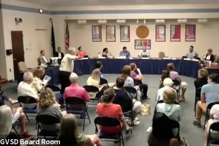 A resident shouts at the Great Valley school board Monday night, upset that people were able to applaud when another resident spoke in favor of diversity and inclusion initiatives.