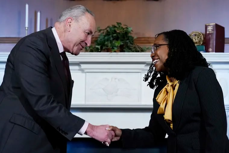 Senate Majority Leader Chuck Schumer (left) shakes hands with Supreme Court nominee Ketanji Brown Jackson at the beginning of their meeting on Capitol Hill.