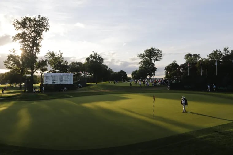 An official checks the 18th green at Lancaster Country Club in 2015, when it hosted the U.S. Women's Open.