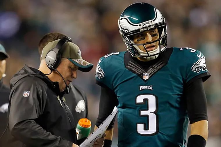 Eagles quarterback Mark Sanchez (right) with head coach Chip Kelly. (Yong Kim/Staff Photographer)