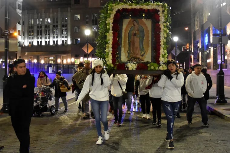 Parishioners carry the image of the Virgin of Guadalupe during a pilgrimage to the Cathedral Basilica SS. Peter and Paul in Philadelphia, on Dec. 11, 2019.