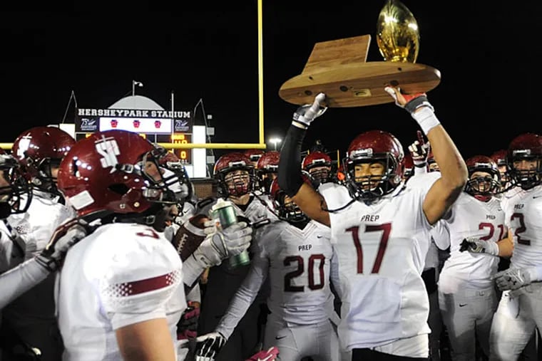 Members of the St. Joe Prep's football team celebrate their 49-41
victory over Pine Richland in the PIAA CLASS AAAA football
championship Saturday, Dec. 13, 2014 in Hershey, Pa. (Bradley C Bower/Staff Photographer)