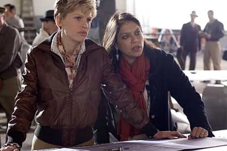 Hilary Swank (left) as Amelia Earhart with director Mira Nair. The director calls Swank "a spiritual daredevil," loving "to be scared by what she doesn’t know."