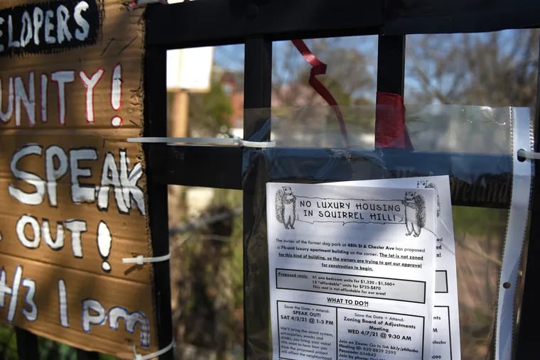 Signs posted at 4720 Chester Ave. on Mar. 29, 2021. At the time, a group of West Philly residents/scientists asked residents to donate a fecal sample to fight gentrification by showing that development could "adversely affect the neighbors' microbiota and increase the risk of developing colorectal cancer." This month, the owner withdrew an application for a 76-unit apartment building.
