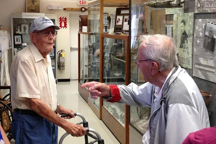 Bill Hogan (left) and Dan Theokas were held in the same German POW camp during World War II. Hogan was leading a tour when the two met for the first time in Millville, N.J. (Photo courtesy Bob Trivellini, vice president of the board of the Millville Army Airfield Museum at Millville Airport)