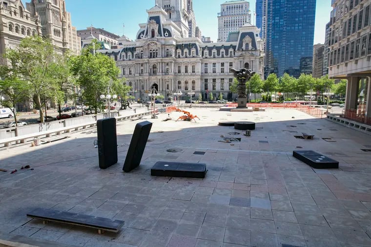 A view of the closed-off Thomas Paine Plaza outside the Municipal Services Building in Philadelphia on Tuesday. The city announced Friday that it is removing the giant game piece sculptures that have been at Thomas Paine Plaza since 1996 in advance of renovations.