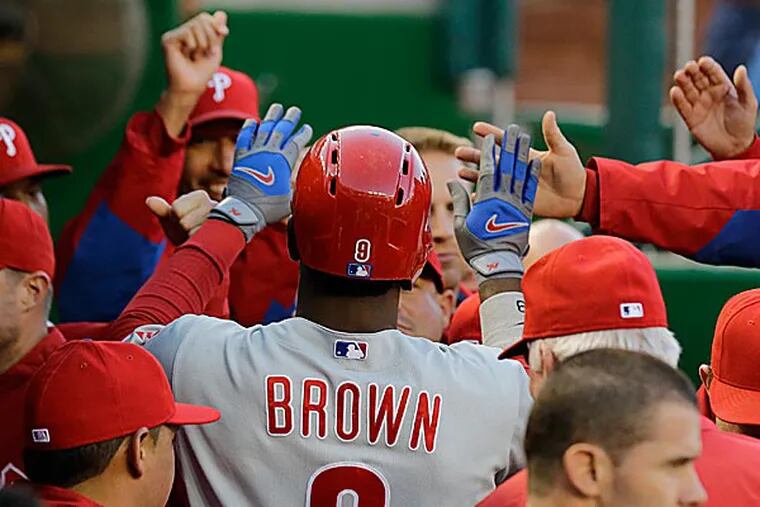 Domonic Brown gets league honor for hitting .348, with doubles, triple and a pair of homers last week. (Alex Brandon/AP)