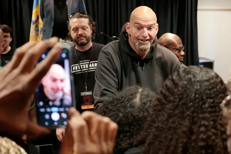 John Fetterman, the Democratic nominee for U.S. Senate, greets people who attended the Neighborhood Rally at Temple University’s Howard Gittis Student Center in Phila., Pa. on October 29, 2022.