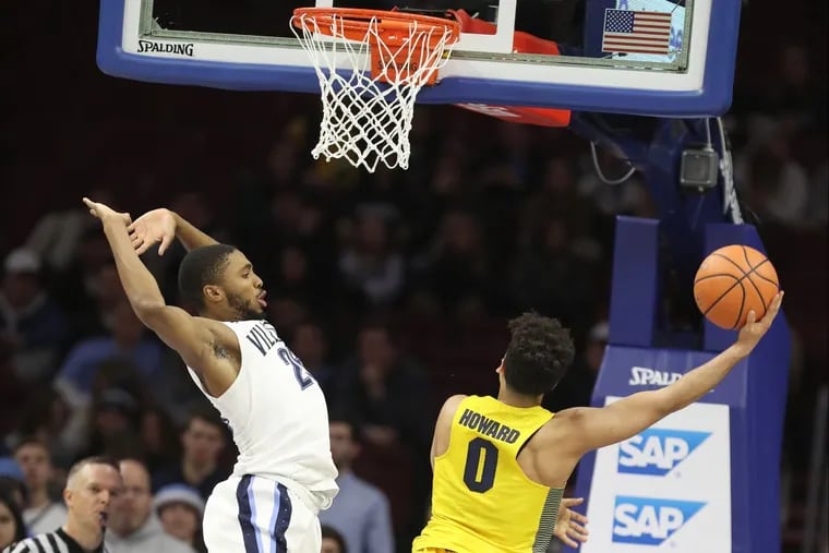 Markus Howard, right, of Marquette scoring two of his 37 points against Villanova on Jan 6.