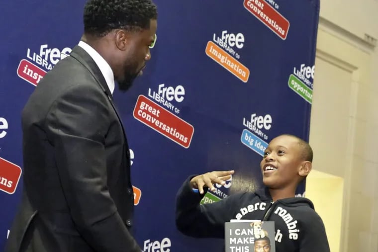 Jordan Morgan, 7, meets comedian Kevin Hart during a meet and greet with fans, to promote his memoir ‘I Can’t Make This Up: Life Lessons’ at the Free Library of Philadelphia.