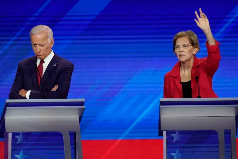 Former Vice President Joe Biden and Sen. Elizabeth Warren, D-Mass.,Thursday, Sept. 12, 2019, during a Democratic presidential primary debate hosted by ABC at Texas Southern University in Houston.