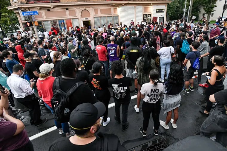 A crowd of protesters gather, Wednesday, Sept. 2, 2020, in Rochester, N.Y., near the site where Daniel Prude was restrained by police officers. Prude, 41, suffocated after police in Rochester, NY, put a "spit hood" over his head while being taken into custody. He died March 30, 2020, after he was taken off life support, seven days after the encounter with police.