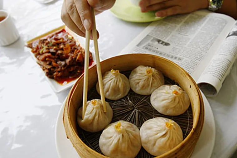 Crab and pork "juicy buns," the delicate skins just firm enough to hold broth. (MICHAEL S. WIRTZ / Staff Photographer)