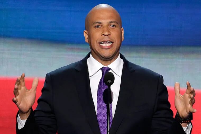 In this Sept. 4, 2012, file photo, Newark, N.J., Mayor Cory Booker addresses the Democratic National Convention in Charlotte, N.C. In a 1992 column in The Stanford Daily, his college newspaper, Booker wrote that he was "disgusted by gays" before a transformative experience with a gay peer counselor changed his views. (AP Photo/J. Scott Applewhite, File)