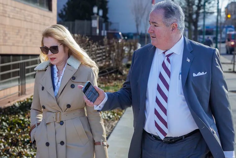 At left is Marita Crawford, former political director Local 98 of the International Brotherhood of Electrical Worker, arriving for sentencing at the U.S. Courthouse in Reading  on Wednesday. A federal judge sentenced her to 15 days behind bars, followed by three months of house arrest.