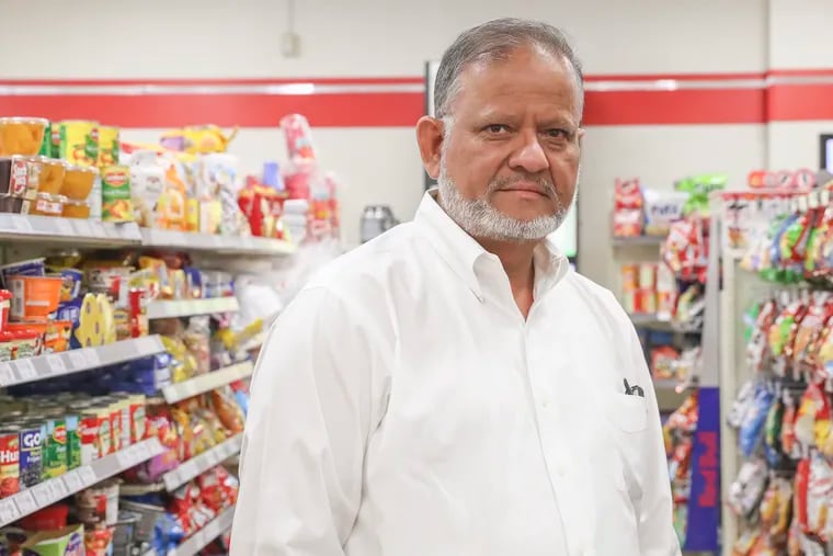 Manzoor Chughtai, a 7-Eleven franchise owner, inside his store at 15th and Cecil B. Moore Avenue in North Philadelphia.  Chughta, who also operates a store in Glenside, says shoplifting is a big problem for merchants.