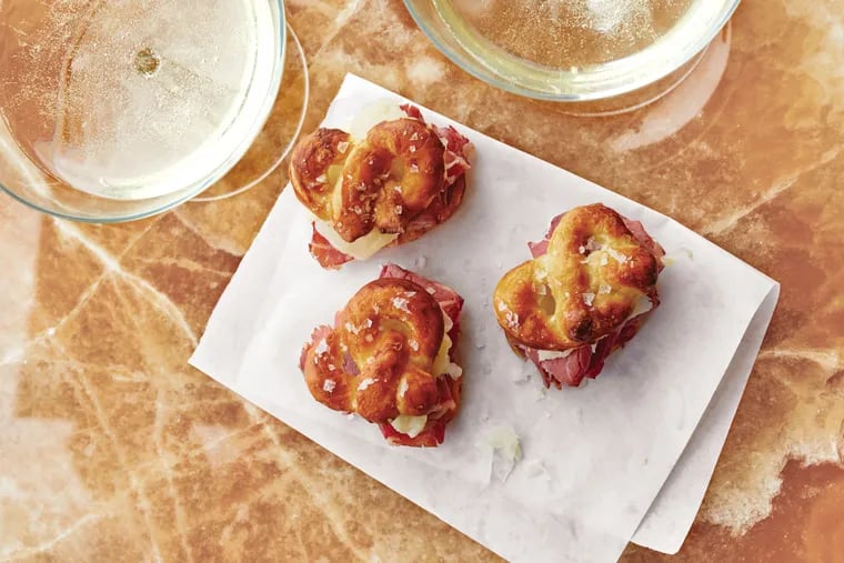 As the Eagles take on the Saints this Sunday, celebrate with delicious Philly-style eats, such as these Mini Reuben Pretzel Sandwiches, along with a dose of New-Orleans-inspired fare.