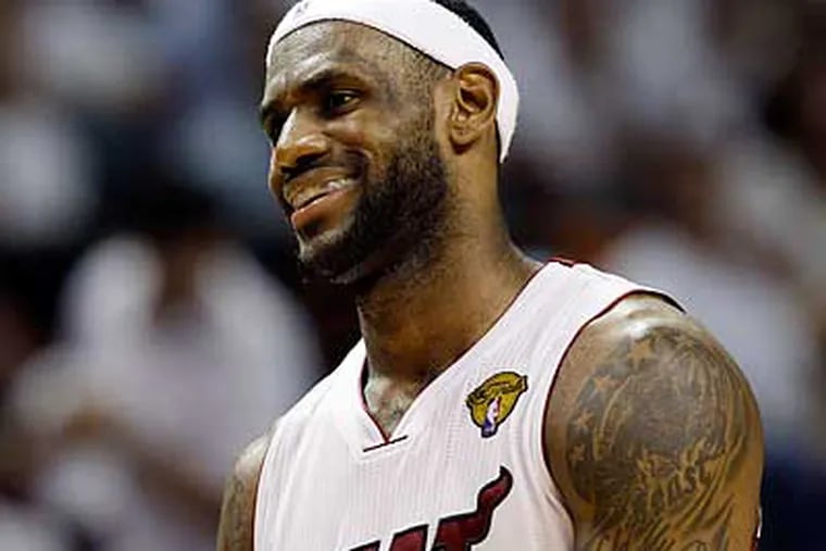 LeBron James and the Heat hope to live up to the hype surrounding their star-laden squad. (David J. Phillip/AP)