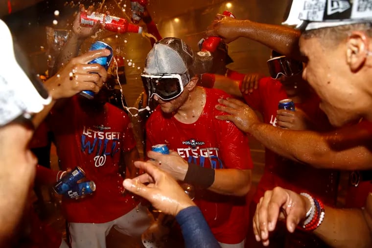 The Phillies hope next year that they'll get to have a champagne celebration like the one the Washington Nationals staged Tuesday night after clinching a wild-card berth.