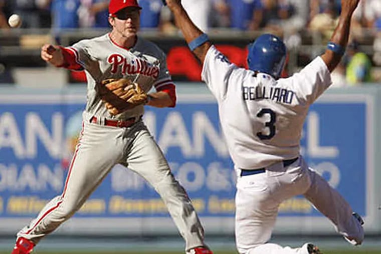 Chase Utley forces Ronnie Belliard at second but throws ball away, allowing Dodgers to tie score in eighth inning. (Ron Cortest / Staff Photographer)